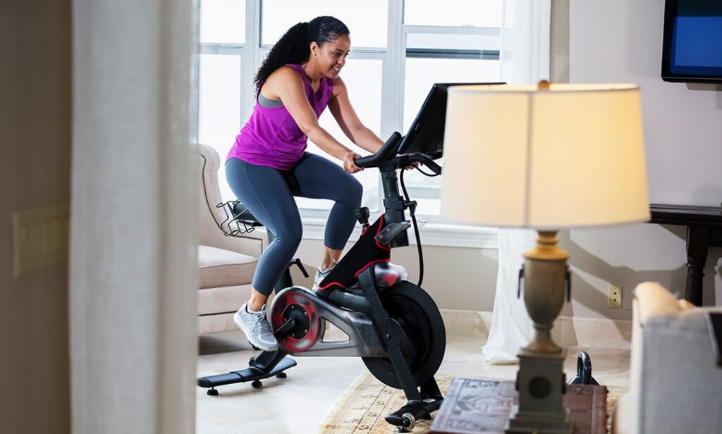 African-American Woman on Exercise Bike at Home
